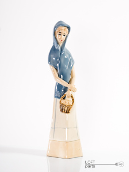 Porcelain figurine of a woman with a basket